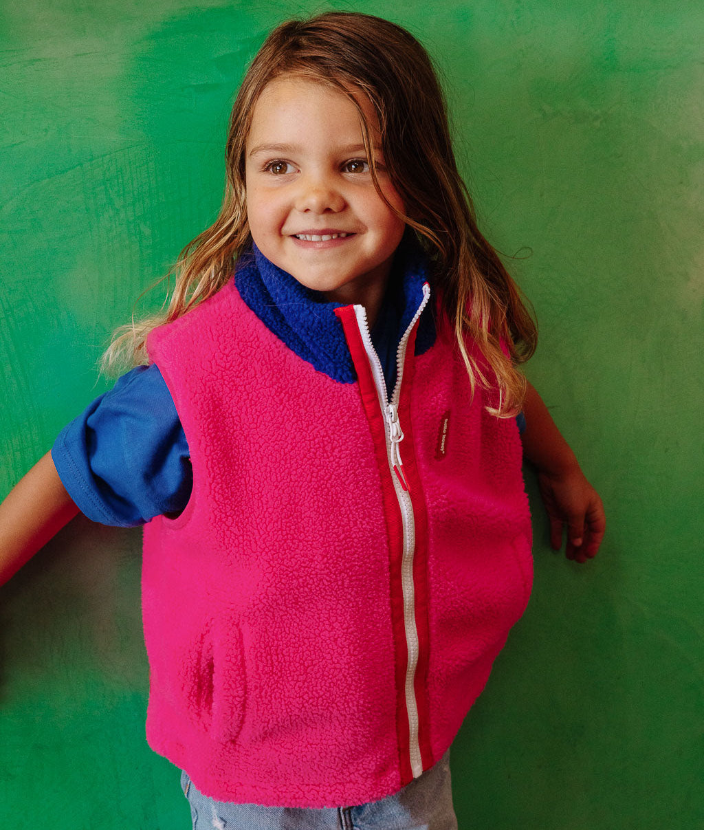 Kinderfleecebodywarmer fuchsia blauwe kraag riszakken Hello Hossy